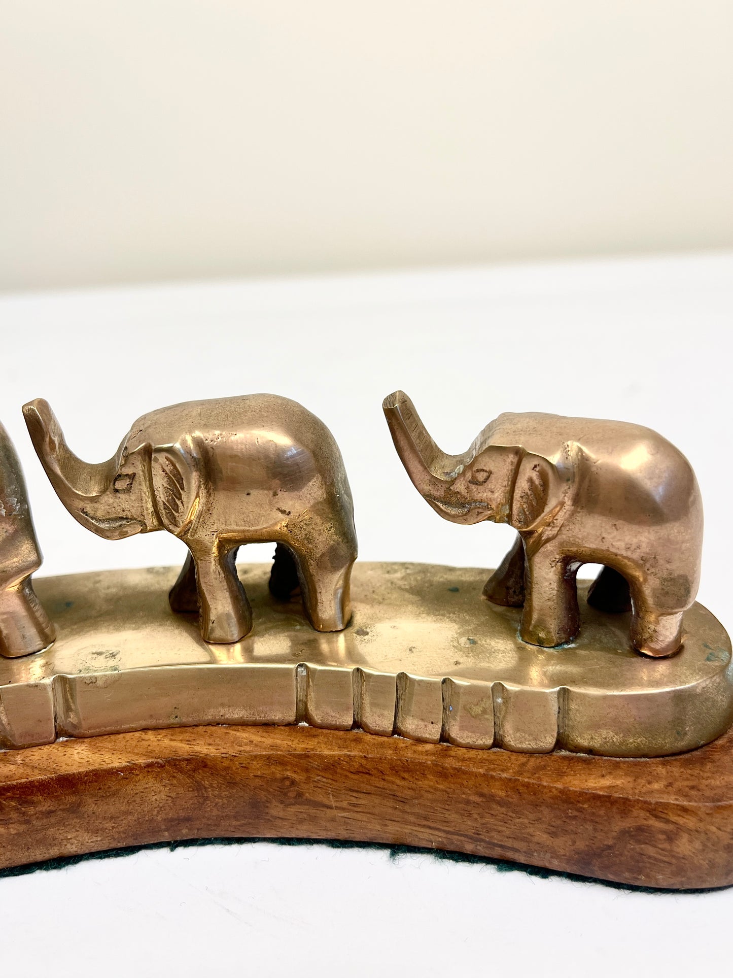 Vintage Brass Elephants on Curved Wood Base
