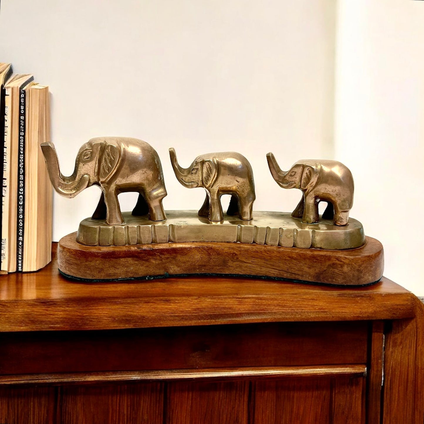 Vintage Brass Elephants on Curved Wood Base
