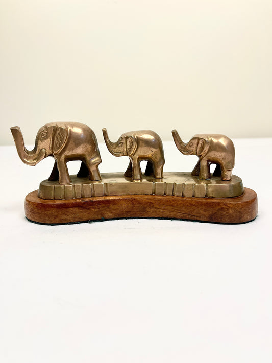 Vintage Brass Elephants on Curved Wood Base