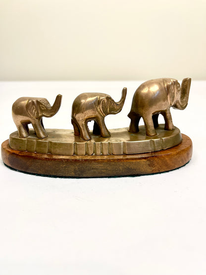 Vintage Brass Elephants on Curved Wood Base